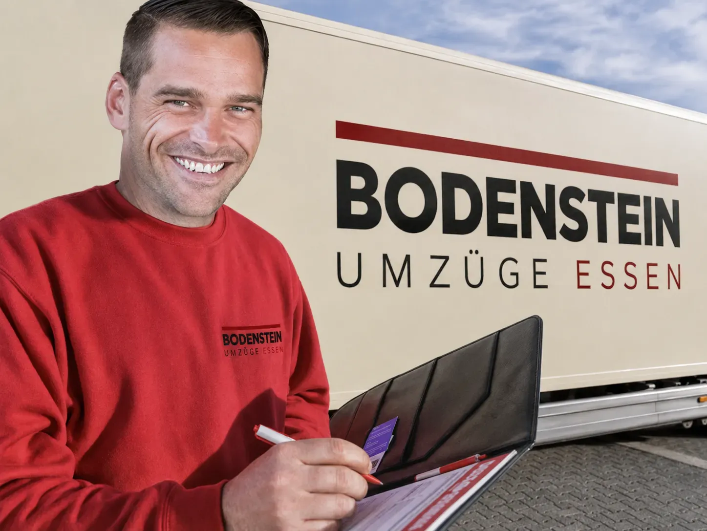 Ansprechperson vor einem Umzugsfahrzeug – Symbolbild